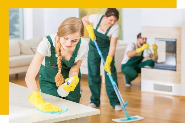 House cleaning team cleaning a living room